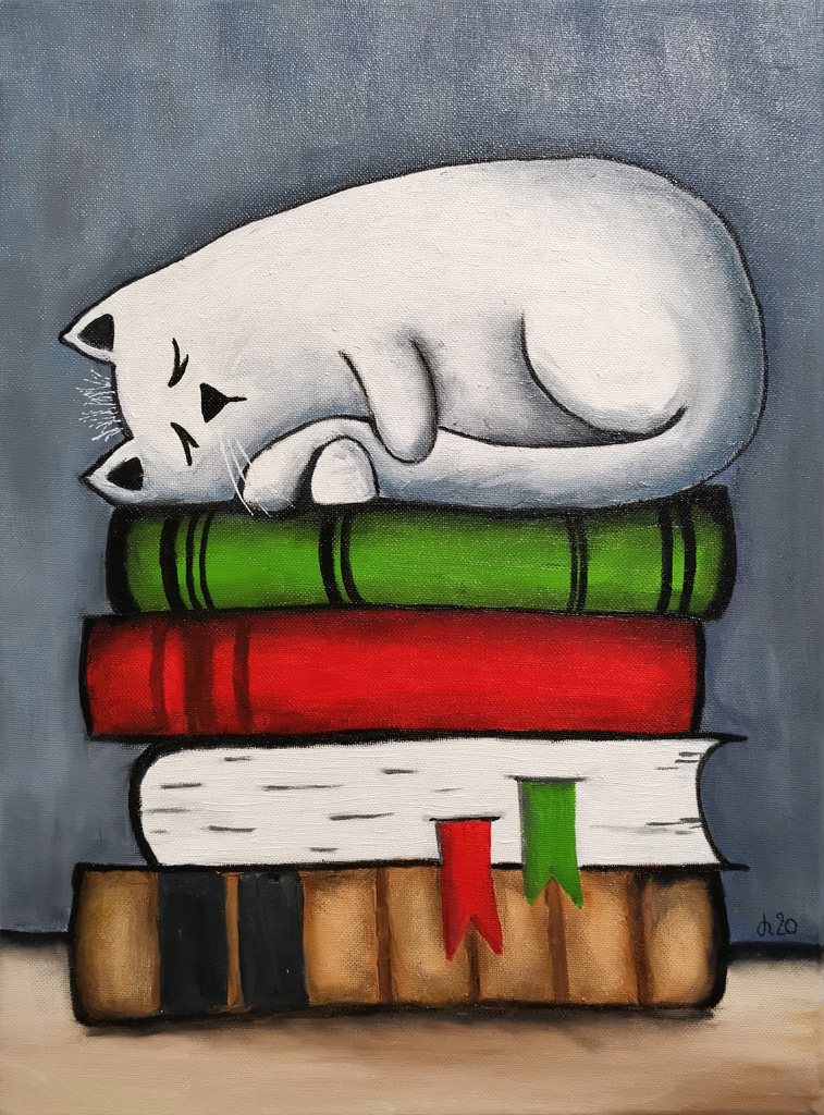 Katze auf dem Buch